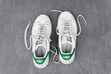 <p style="font-size:10px">Charbel-joseph H. Boutros, Amitié, 2018, Stan Smith shoes, dimensions variable</p>
<p style="font-size:10px">Two new shoes from the same pair are separated, the left one was worn by the artist during his trips in Europe for 6 months. The right one was worn by his friends in Beirut. The two shoes are reunited for the exhibition.</p> - © Image courtesy of the artist and Grey Noise, Dubai., Paris Internationale