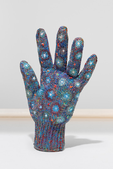 A glove sculpture covered in the artist's night vision blue red and green pattern - © Courtesy the artist and Shmor&eacute;vaz, picture &copy; Felix Rapp, Paris Internationale